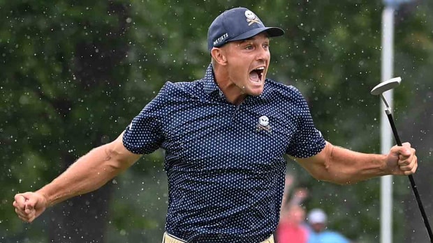 Bryson DeChambeau celebrates after hitting a birdie putt on 18 and shooting a record 58 during the final round of the LIV Golf event at The Old White Course at the Greenbrier Resort.